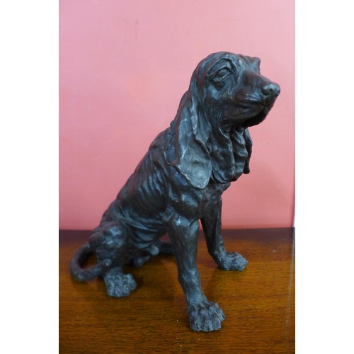 84 - A bronze figure of a seated spaniel, 36cms h