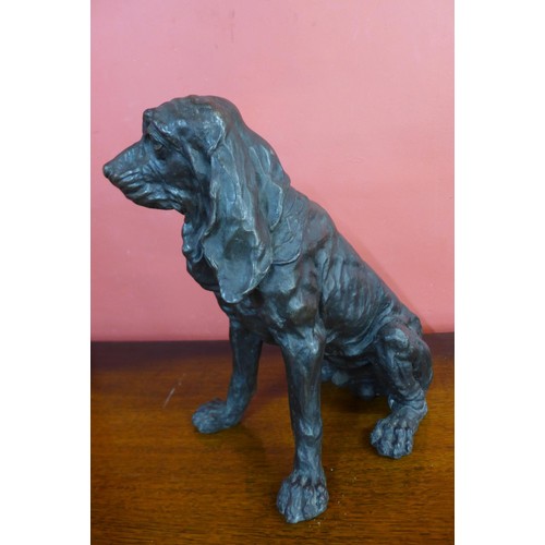 84 - A bronze figure of a seated spaniel, 36cms h