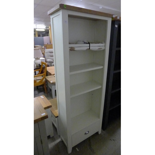 1900 - An oak and cream tall bookcase *This lot is subject to VAT