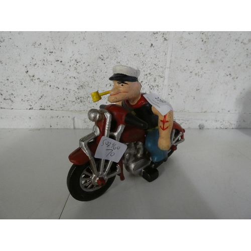 2143 - Popeye figure on motorcycle * this lot attracts vat