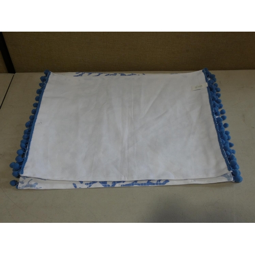 3020 - Four blue/white patterned pom pom place mats (45cm x 36cm each)  * This lot is subject to VAT