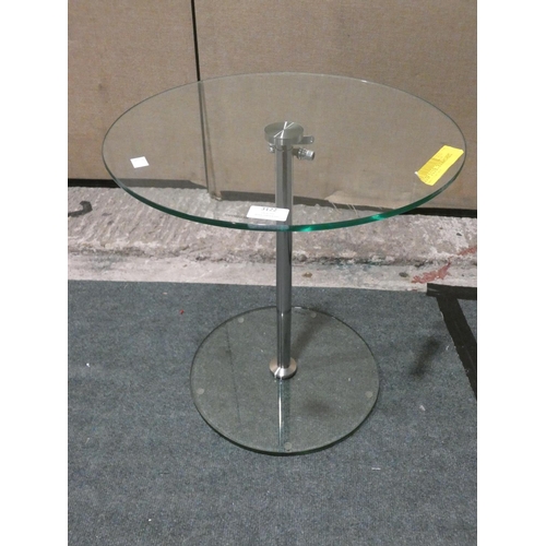 3122 - A glass/chrome circular height adjustable side table * this lot is subject to VAT