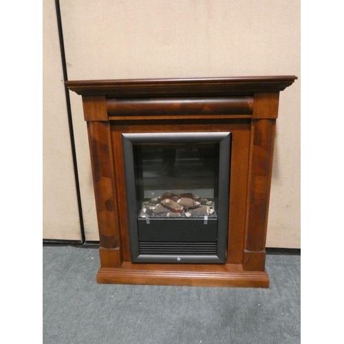 3144 - A Taylorstow darkwood fire surround with built in electric fire * this lot is subject to VAT