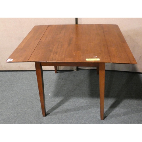 3154 - A darkwood drop-leaf dining table (damaged corner) * this lot is subject to VAT