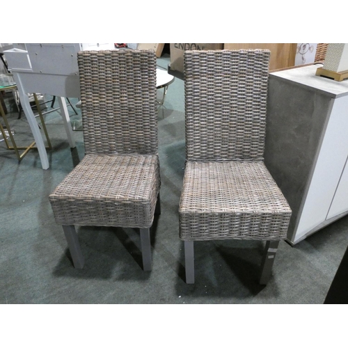 3190 - Two grey wicker style dining chairs * this lot is subject to VAT