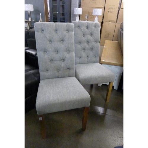 1409 - A pair of grey buttoned chairs * this lot is subject to VAT