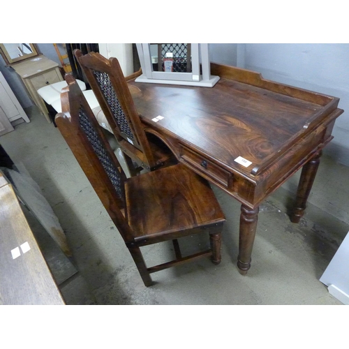 1892 - An Indian hardwood desk and two chairs - damaged top * this lot is subject to VAT