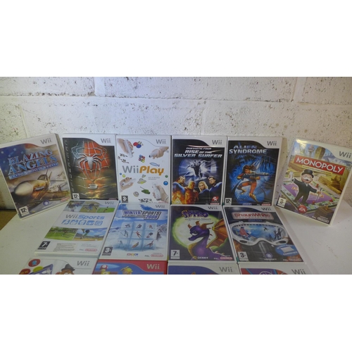 2101 - Wii console with 2 remotes & nunchucks, balance board, sports pack with approx. 14 games - W