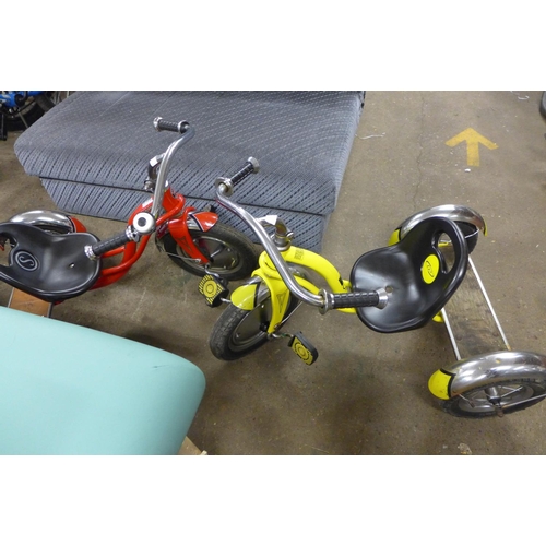 2334 - 2 Trikes (red Schwinn, yellow Powerlite)