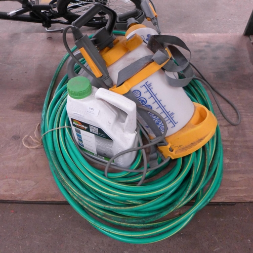 2405 - Green hosepipe, 2 spray bottles, chainsaw oil, Roundup Probio Hervicide