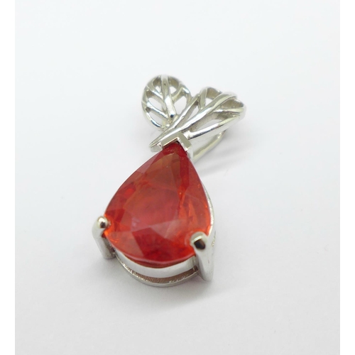 1299 - An 18ct white gold pendant with faceted pear shaped red/orange stone, 2.4g, width of stone 7mm