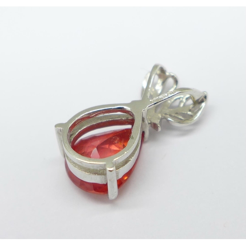 1299 - An 18ct white gold pendant with faceted pear shaped red/orange stone, 2.4g, width of stone 7mm