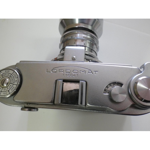 2999 - Antique Lordomat camera in case with accessories including lens, with instructions (West Germany)