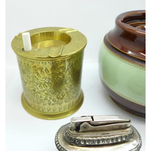 700 - Two Ronson table lighters, a brass ash tray with cigarette dispenser, a Bakelite cigarette box and a... 