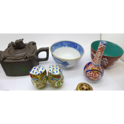 704 - Oriental items, a cloisonne salt and pepper pot, two cloisonne owls, tea bowls, a carving, teapot, m... 