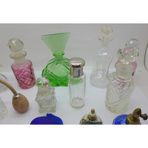 706 - Thirteen perfume bottles and atomisers