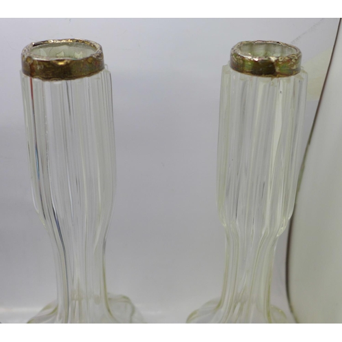 709 - A pair of silver rimmed glass vases, a glass clown and four paperweights