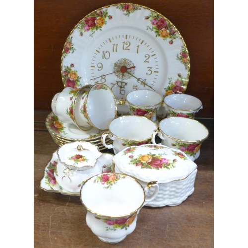 710 - A collection of Royal Albert Old Country Roses china, five cups and saucers, clock, two vases, bowl ... 