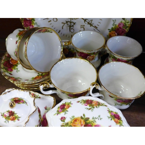 710 - A collection of Royal Albert Old Country Roses china, five cups and saucers, clock, two vases, bowl ... 