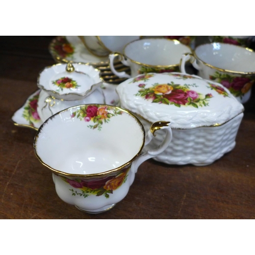 710 - A collection of Royal Albert Old Country Roses china, five cups and saucers, clock, two vases, bowl ... 