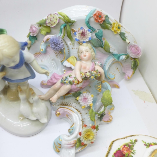 714 - Two cherub wall brackets, five items of Royal Albert, a continental figure of a girl and a Denby com... 