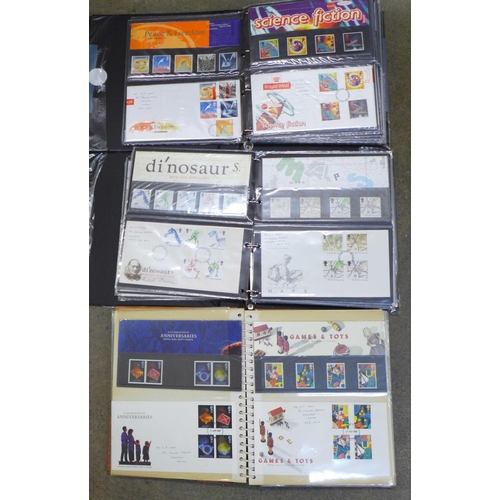 719 - Three albums of first day covers and Royal Mail packs, (approximately 90)