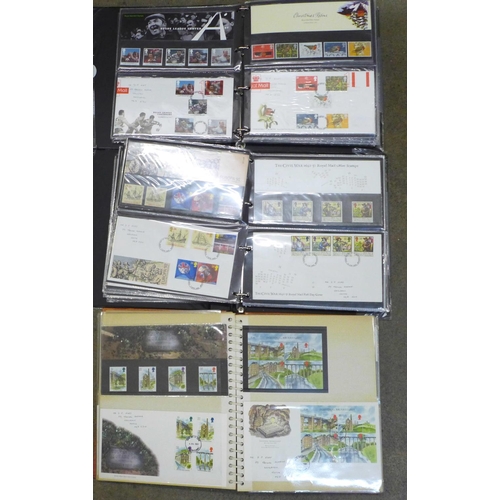 719 - Three albums of first day covers and Royal Mail packs, (approximately 90)