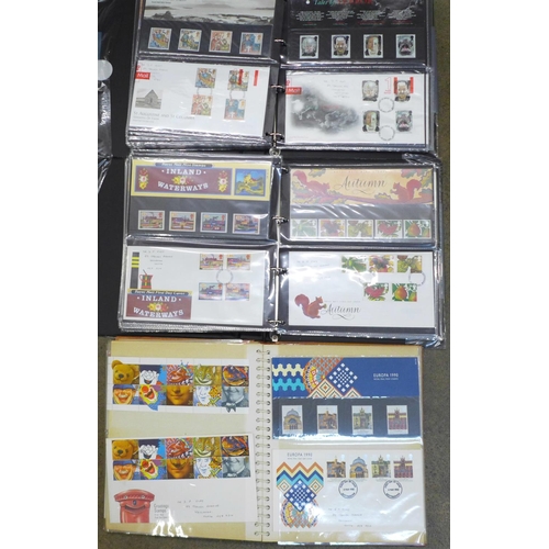 719 - Three albums of first day covers and Royal Mail packs, (approximately 90)