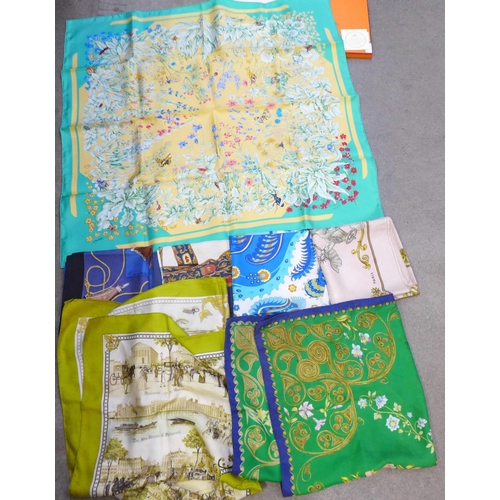 733 - A collection of seven Hermes scarves; one boxed and six others including 'Paris, London, 1850, Les B... 