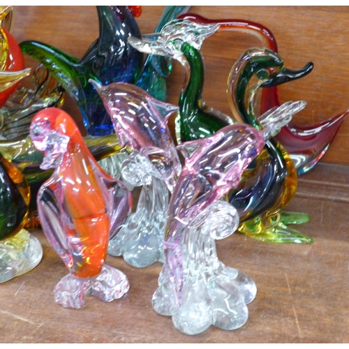 736 - Fourteen glass models; twelve birds and two dolphins, one bird a/f, chip on head