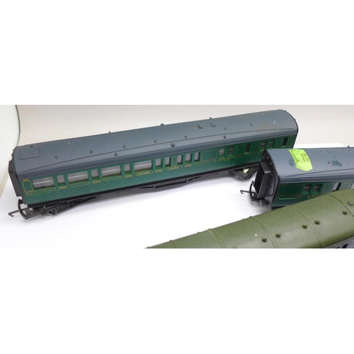 740 - Four OO gauge railway carriages; three Hornby and one Tri-ang