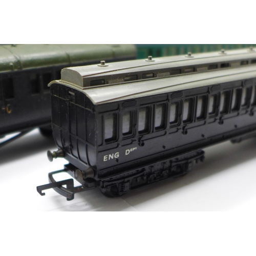 740 - Four OO gauge railway carriages; three Hornby and one Tri-ang