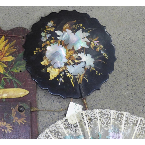 747 - A papier-mache lacquered hand fan inlaid with mother of pearl, three fans, circular box, Art Nouveau... 