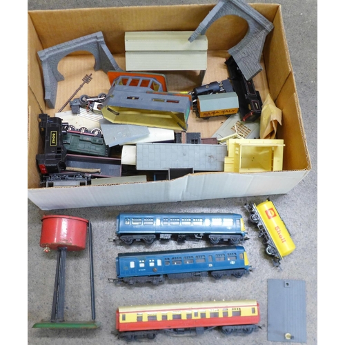 748 - A collection of model rail; buildings, locomotive in parts, etc. (25)