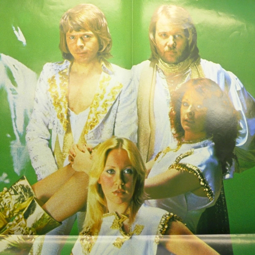 764 - An ABBA fan club folder with fact sheets and two posters