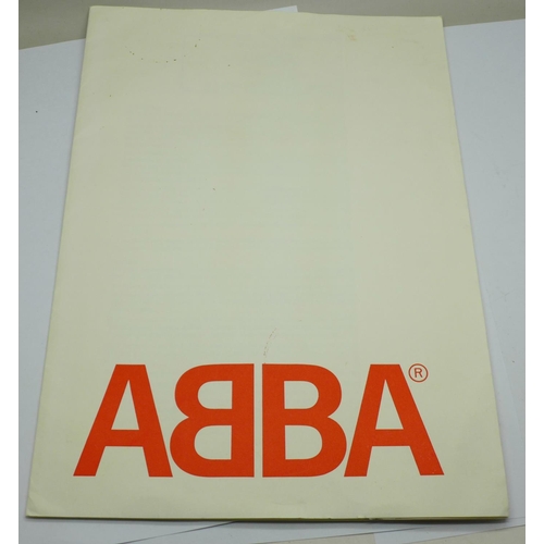 764 - An ABBA fan club folder with fact sheets and two posters