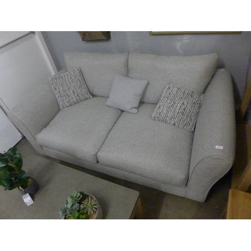 1495 - A grey upholstered three seater sofa