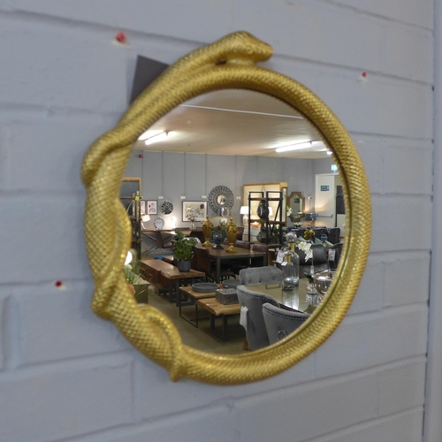 1533 - A round serpent metal framed wall mirror, height 36cms (550337538)   #