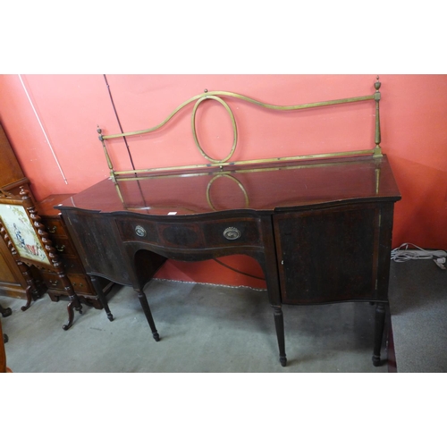 73 - An Edward VII Maple & Co. inlaid mahogany serpentine sideboard