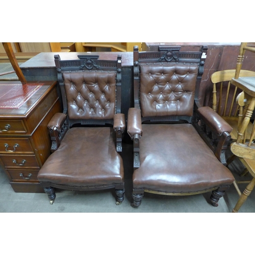 264 - A pair of Victorian carved mahogany and leather upholstered lady's and gentleman's armchairs