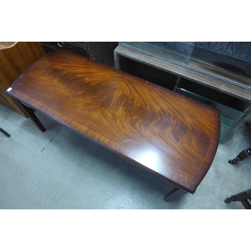 388 - A mahogany coffee table and an oak wine table