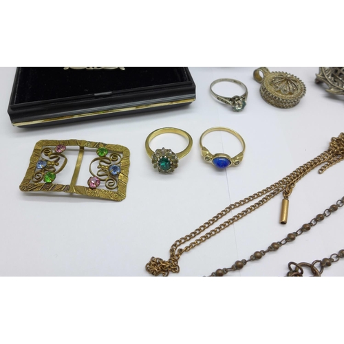 1035 - A silver brooch, costume jewellery, a silver napkin ring and a silver thimble