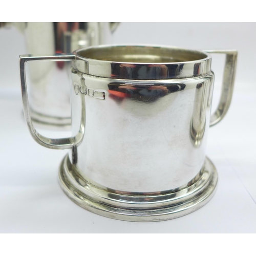 1046 - A 1940's Art Deco Indian silver four piece tea service by Hamilton & Co., Calcutta, total weight 142... 