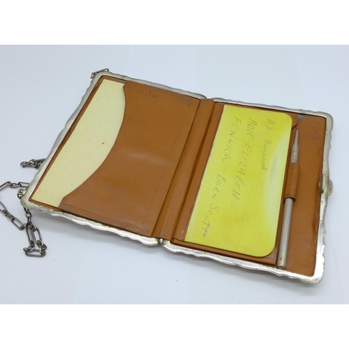 1051 - A silver purse/wallet with note pad, Birmingham 1912, Samuel M. Levi, bears initials, 114.9g, 73mm x... 