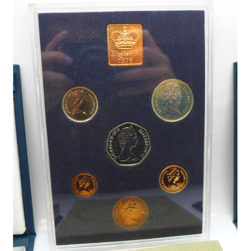 1052 - Three Royal Mint proof sets:- 1976, 1994 including the Special Bank of England £2 and D-Day 50p coin... 