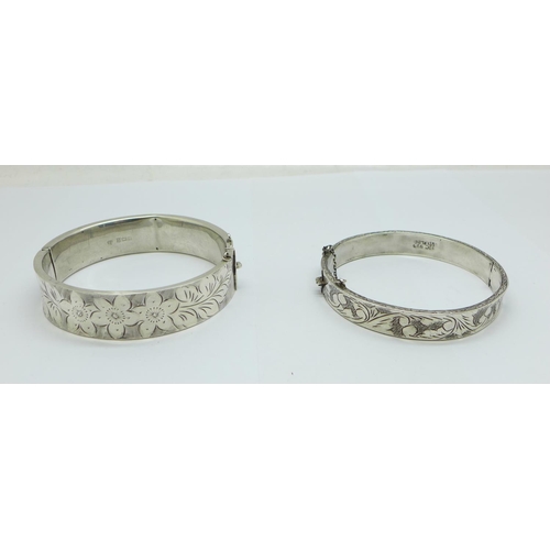 1084 - Two silver bangles, 38g, both dented