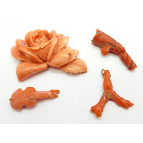 1086 - Five pieces of carved coral including a rose plaque, two a/f