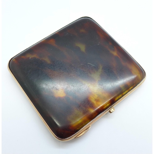 1090 - A 9ct gold and tortoiseshell cigarette case, Birmingham 1928, Walker & Hall