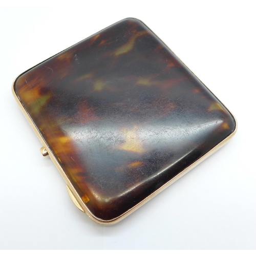 1090 - A 9ct gold and tortoiseshell cigarette case, Birmingham 1928, Walker & Hall