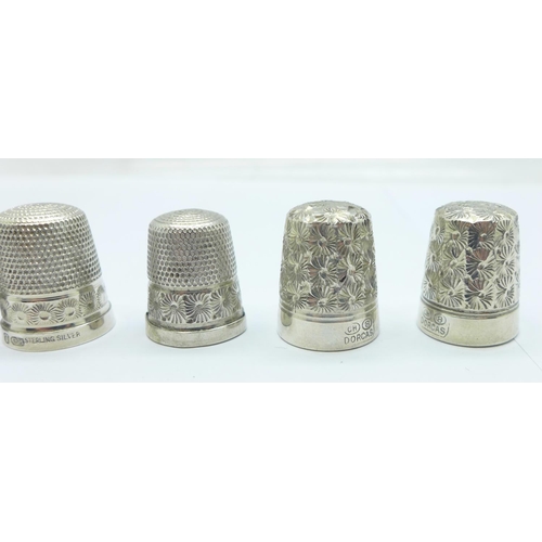 1100 - Four Charles Horner silver thimbles and three Dorcas thimbles